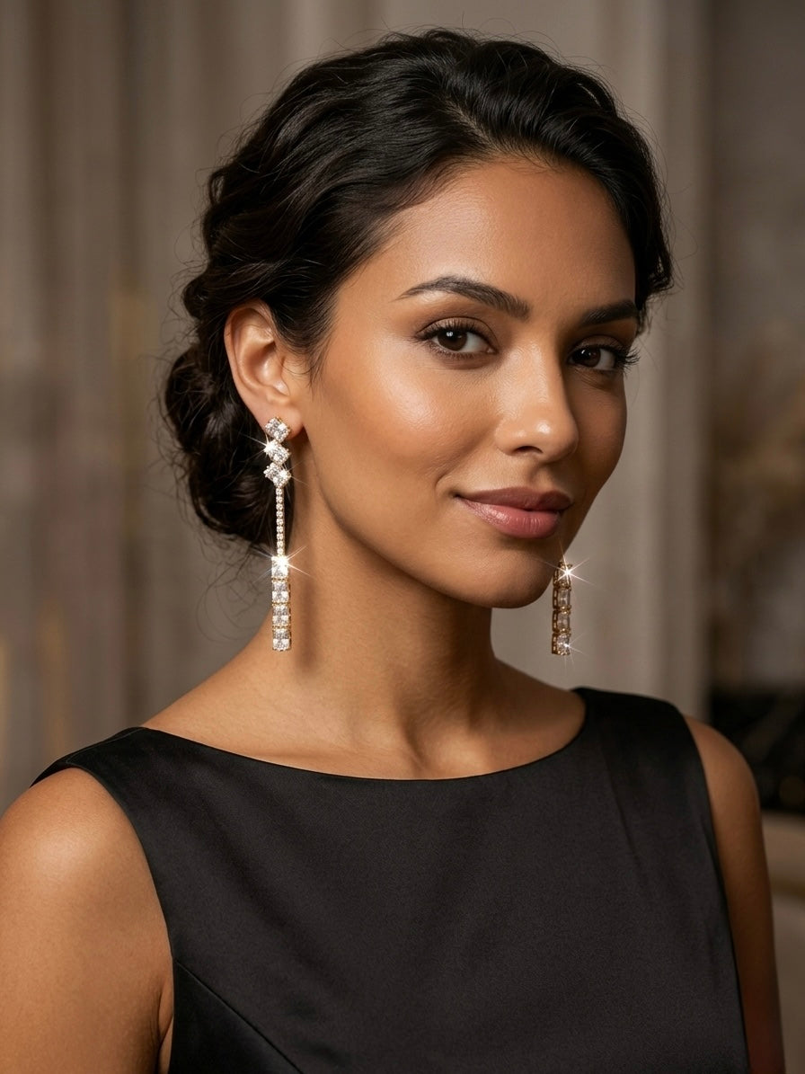 Luxurious gold geometric diamond drop earrings.