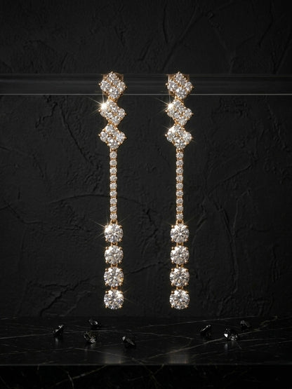 Luxurious gold geometric diamond drop earrings.