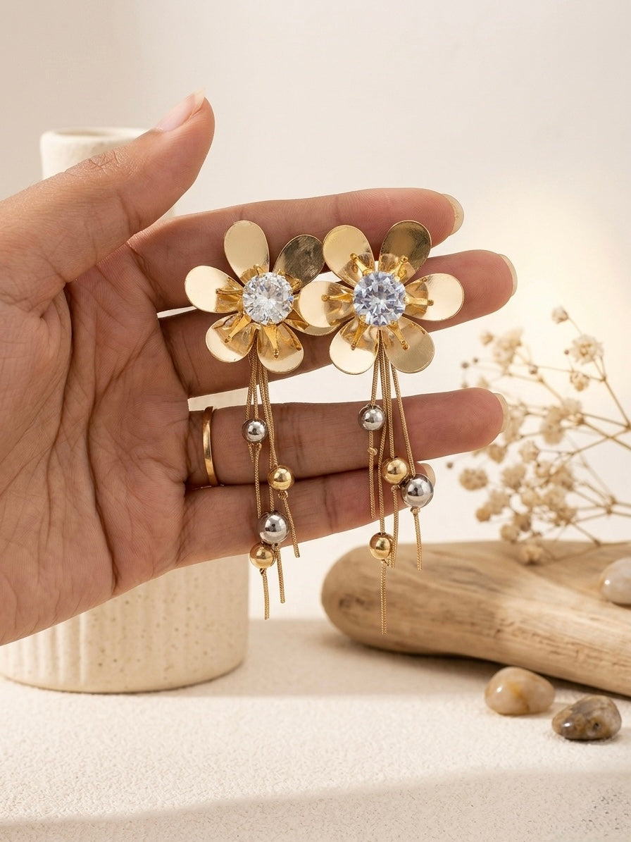 Elegant gold floral drop statement earrings.