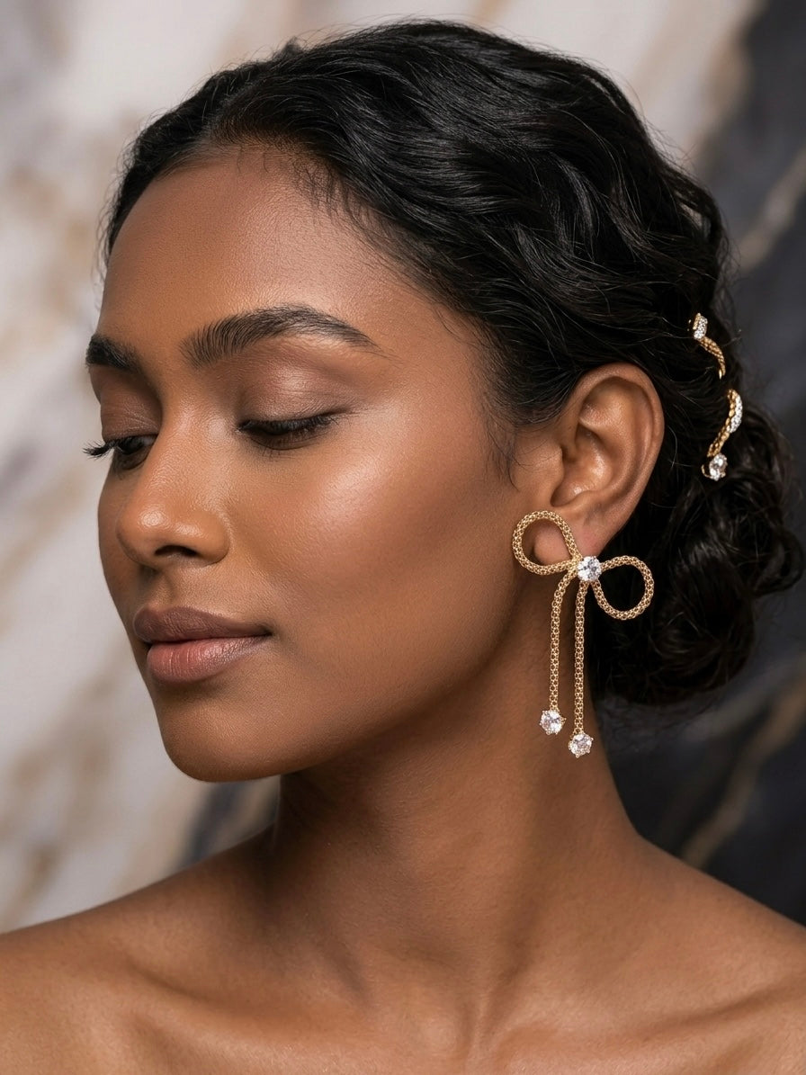 Charming gold bow drop crystal earrings.