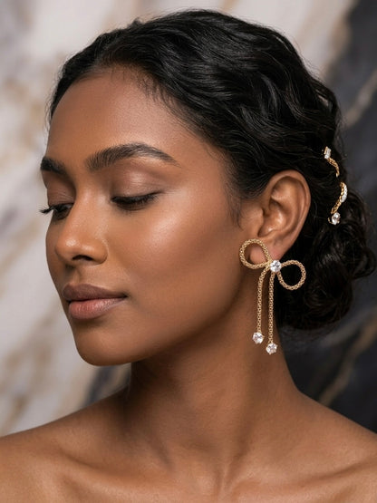 Charming gold bow drop crystal earrings.