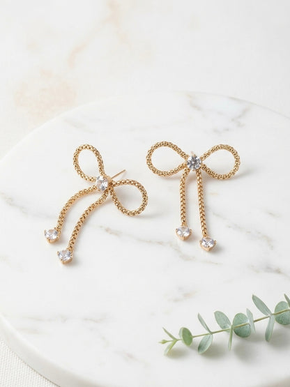 Charming gold bow drop crystal earrings.