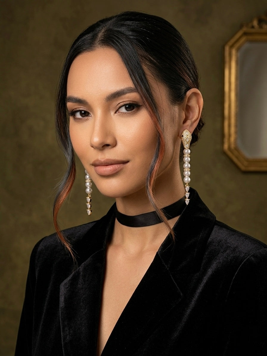 Luxury gold snake pearl drop earrings.