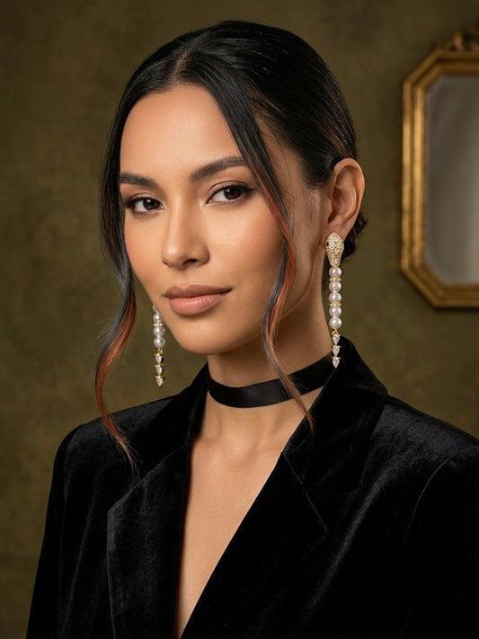 Luxury gold snake pearl drop earrings.