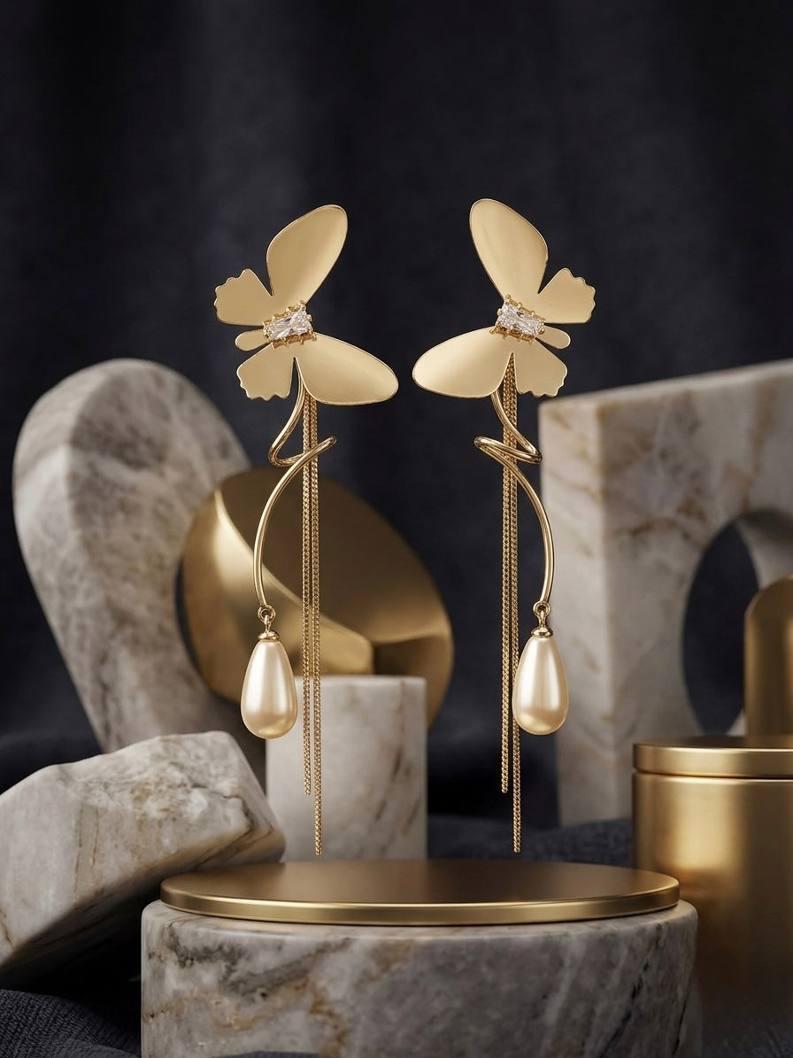 Statement gold butterfly long tassel earrings.