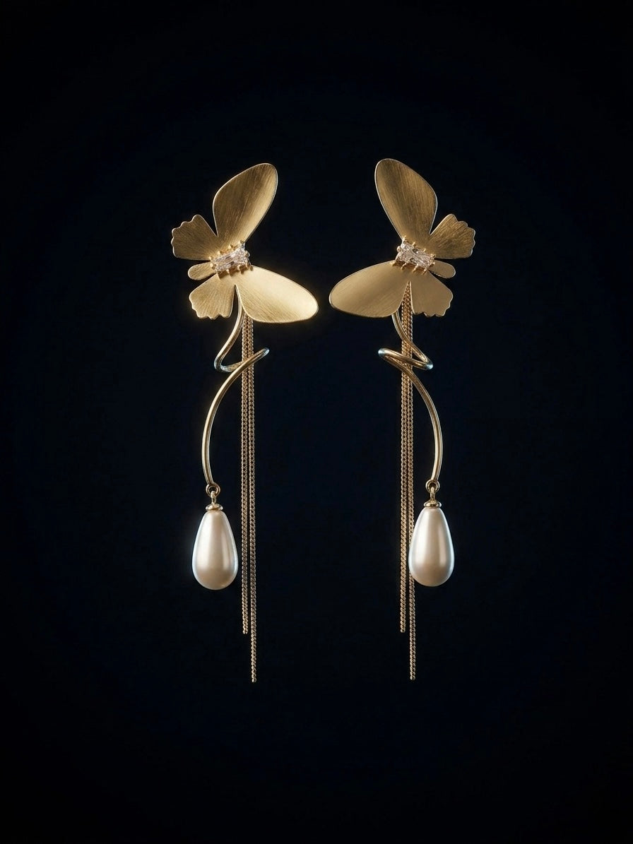 Statement gold butterfly long tassel earrings.