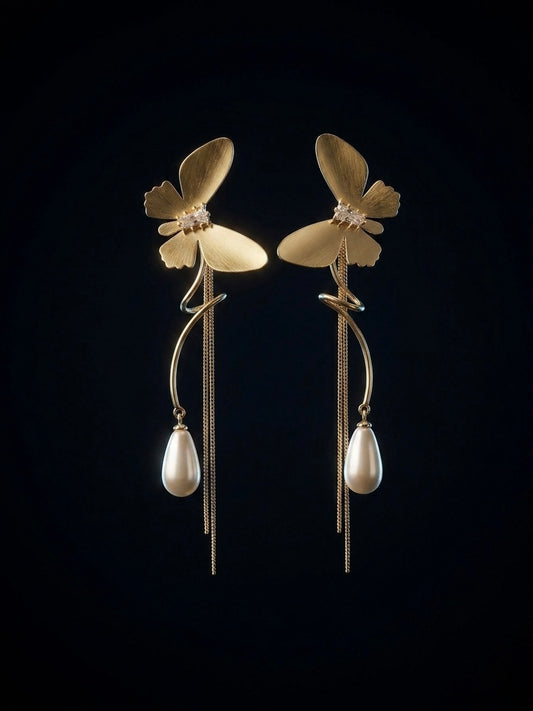 Statement gold butterfly long tassel earrings.