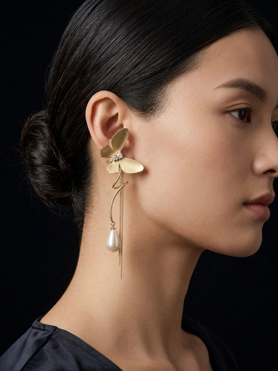 Statement gold butterfly long tassel earrings.