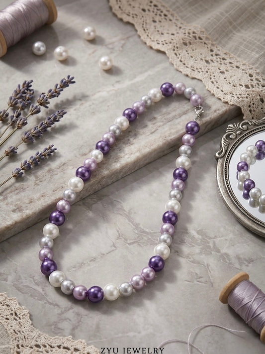Elegant dark purple pearl strand necklace.