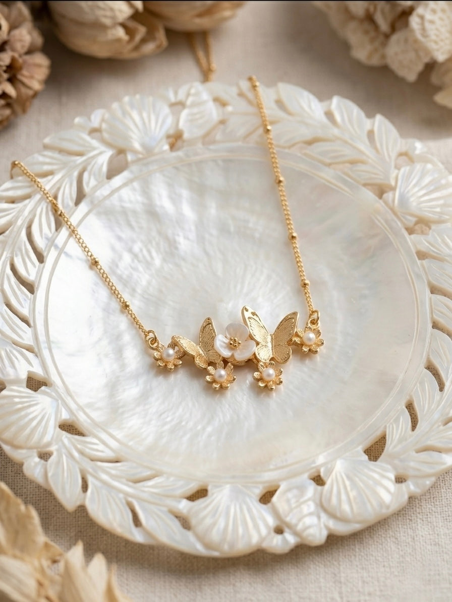Charming gold butterfly flower satellite necklace.