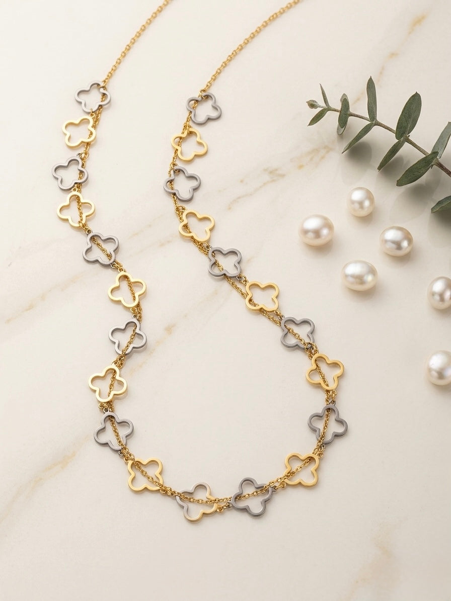 Chic gold and silver clover necklace.