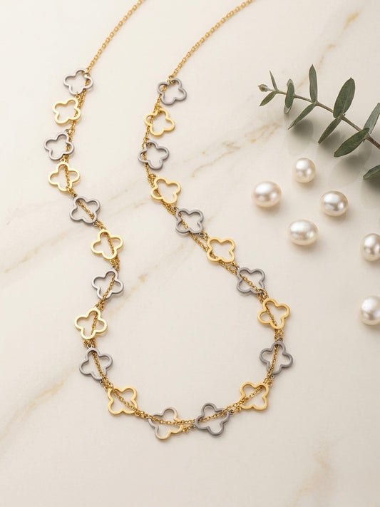 Chic gold and silver clover necklace.