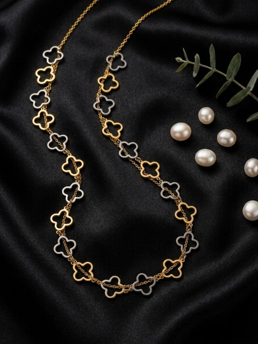 Chic gold and silver clover necklace.