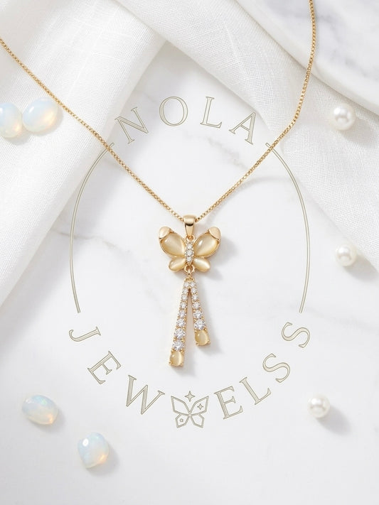 Graceful gold opal butterfly tassel necklace.