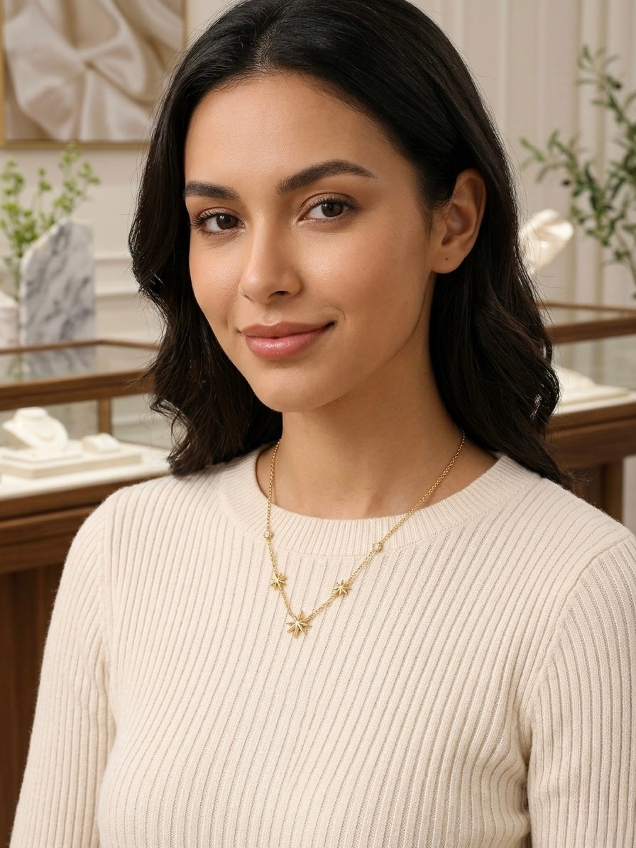 Delicate gold multi-star charm necklace.