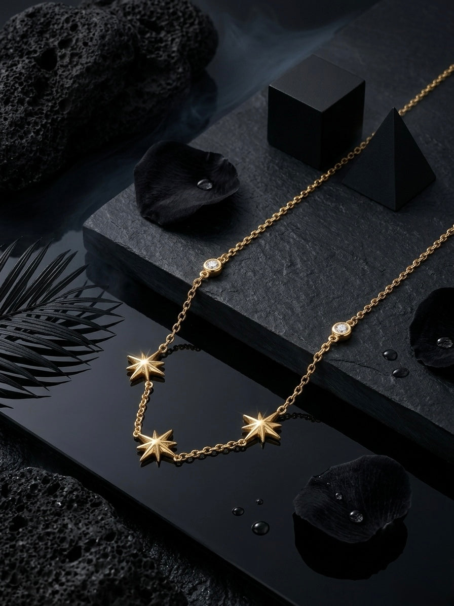 Delicate gold multi-star charm necklace.