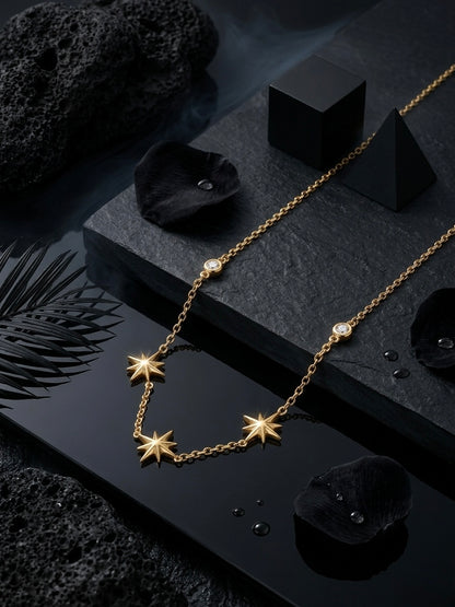 Delicate gold multi-star charm necklace.