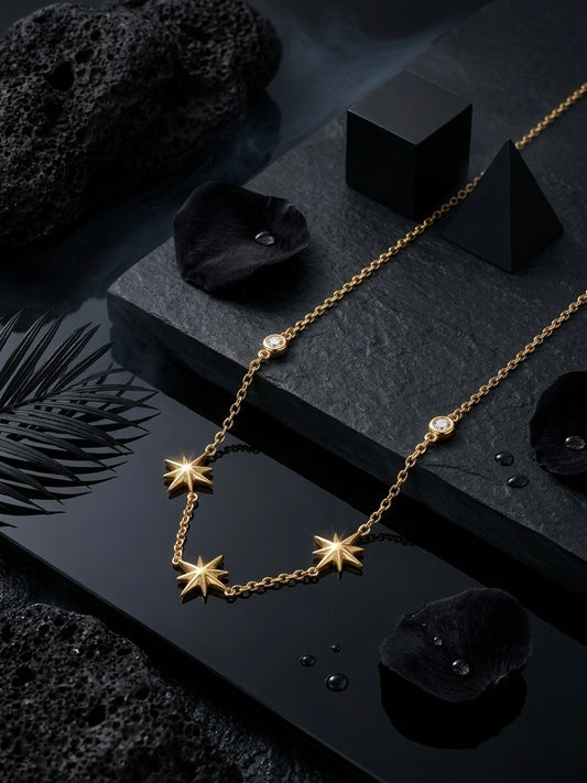 Delicate gold multi-star charm necklace.