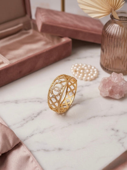 Luxurious cutout gold textured statement bracelet.
