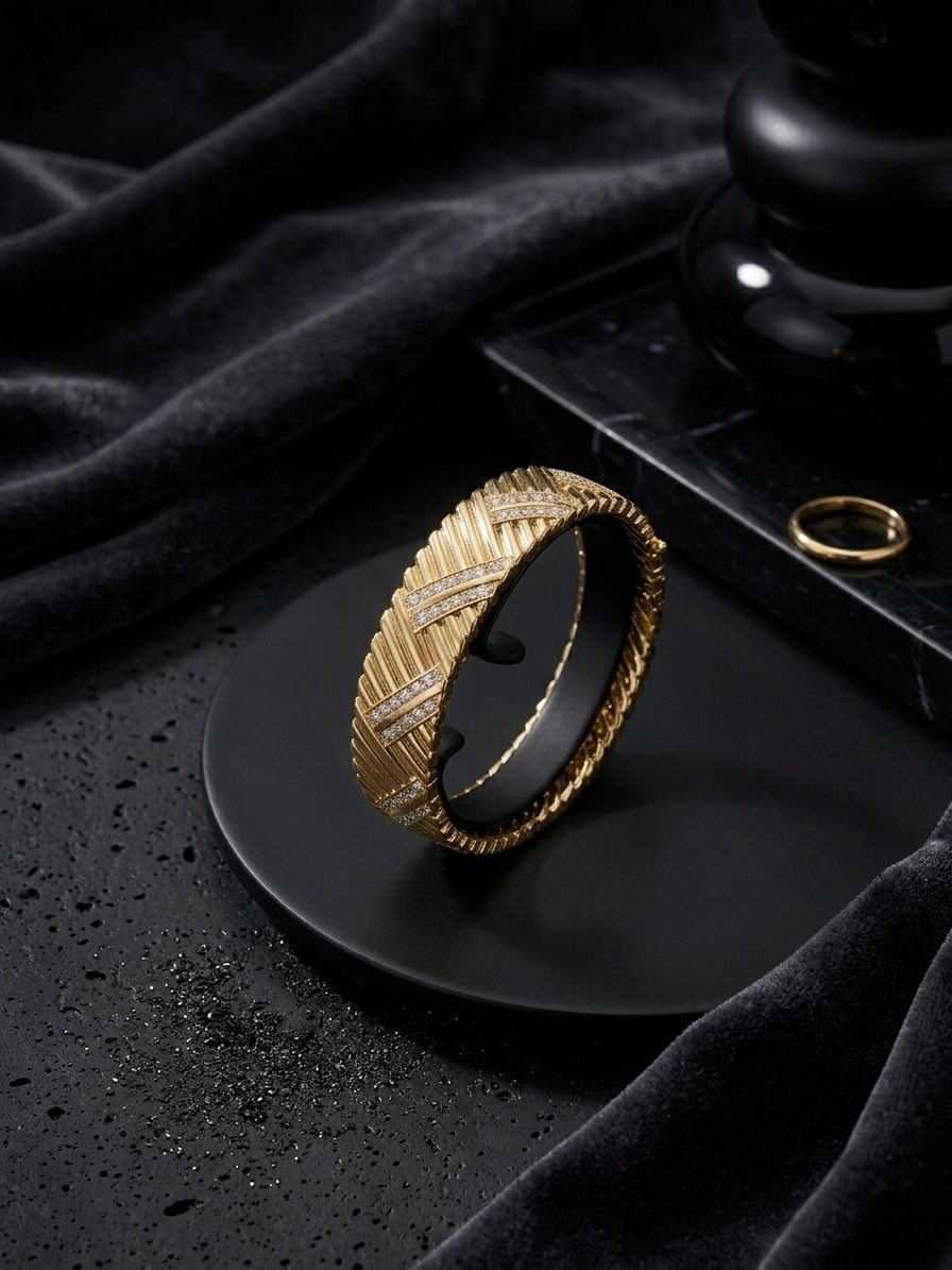 Luxury chevron textured gold diamond bangle.