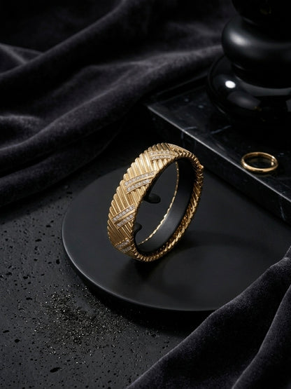 Luxury chevron textured gold diamond bangle.