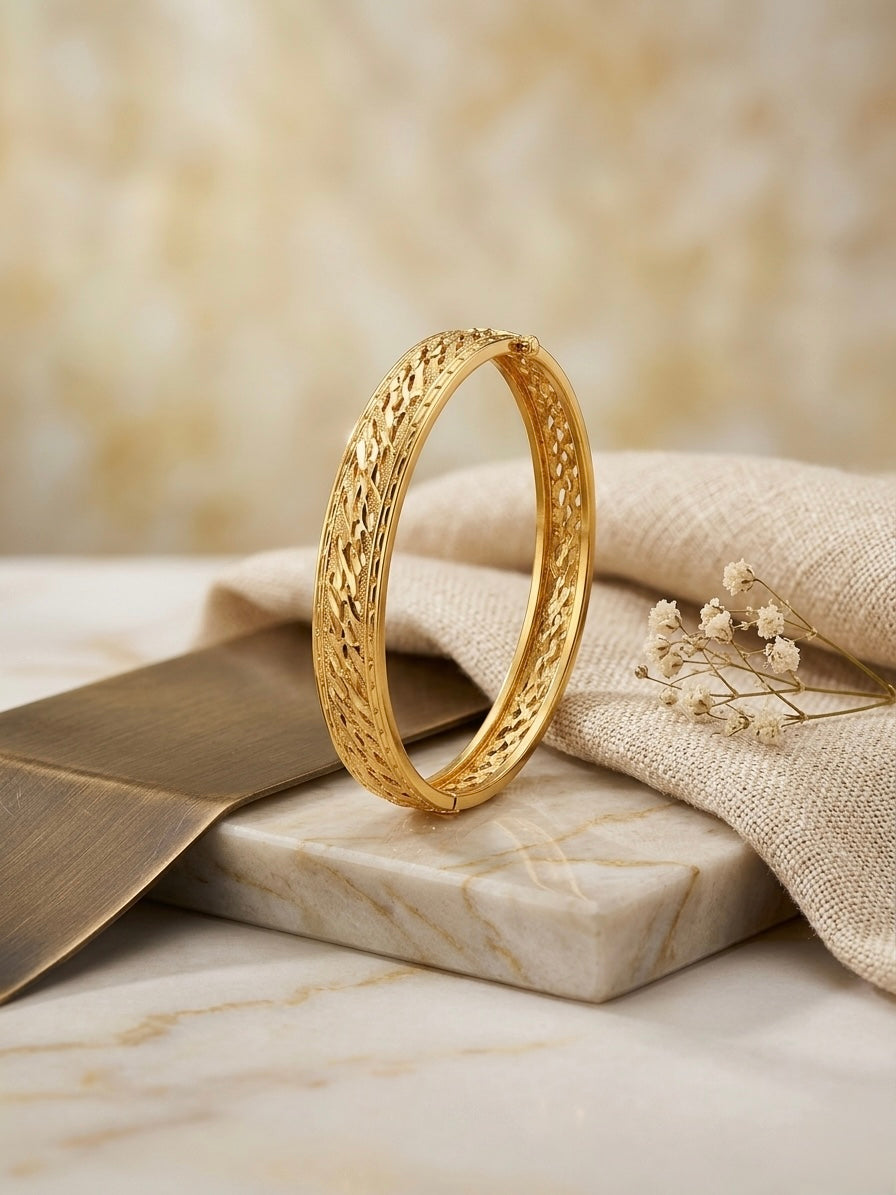 Elegant woven pattern gold luxury bracelet.