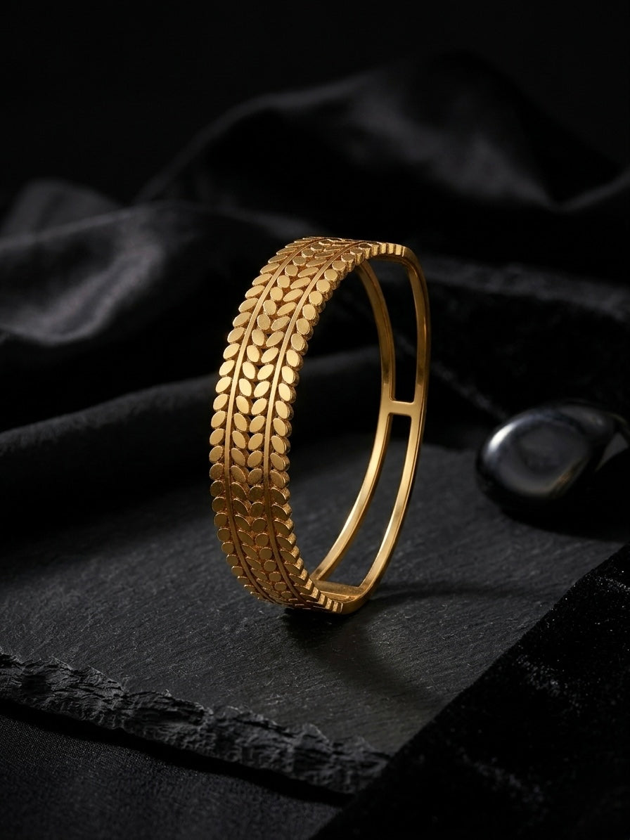 Sophisticated textured gold botanical cuff bracelet.