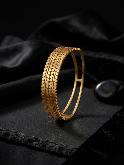 Sophisticated textured gold botanical cuff bracelet.