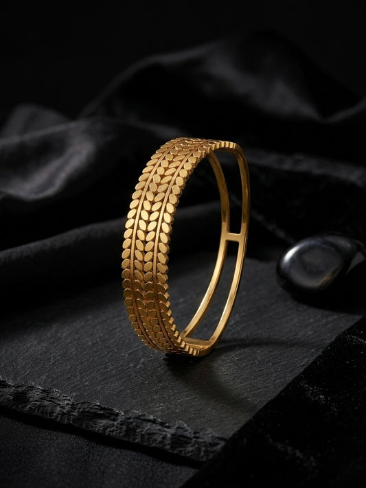 Sophisticated textured gold botanical cuff bracelet.
