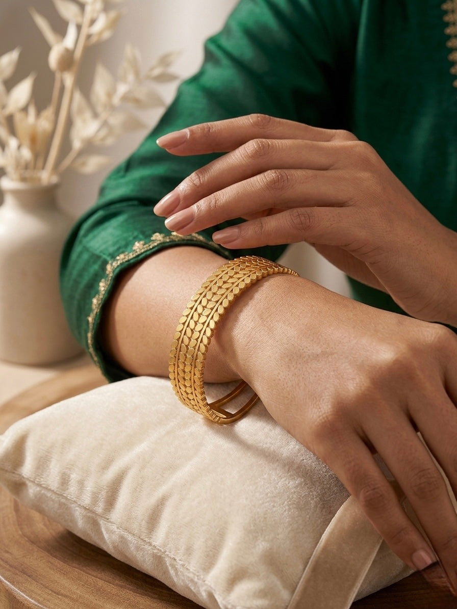 Sophisticated textured gold botanical cuff bracelet.