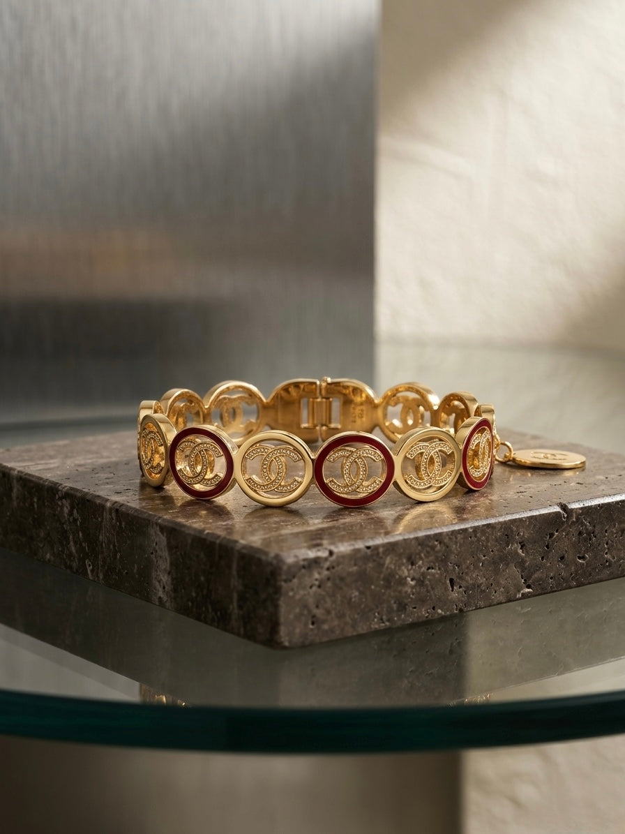Luxury gold logo link charm bracelet.