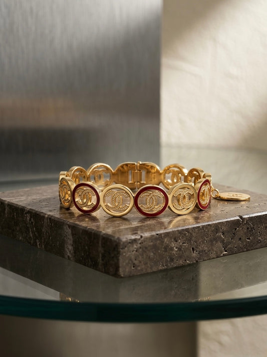 Luxury gold logo link charm bracelet.