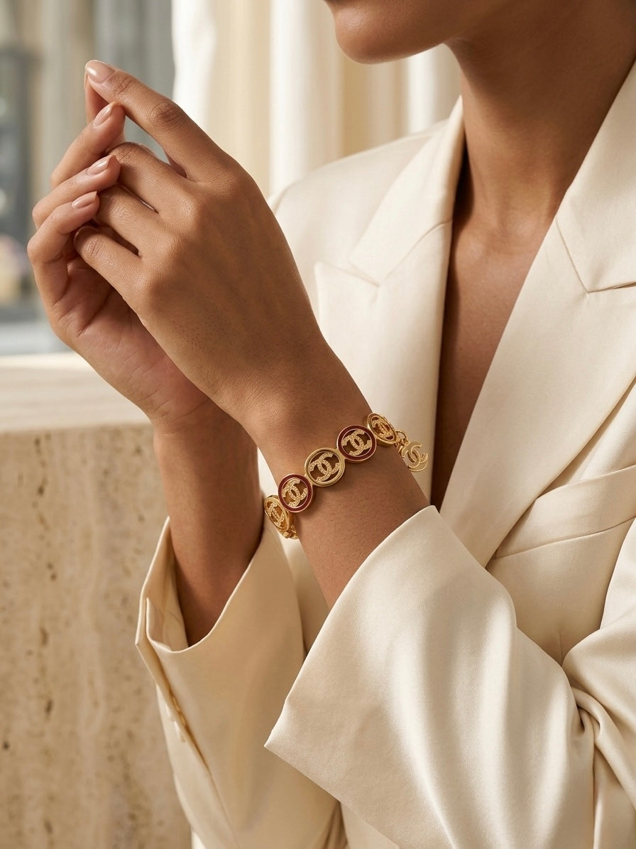 Luxury gold logo link charm bracelet.