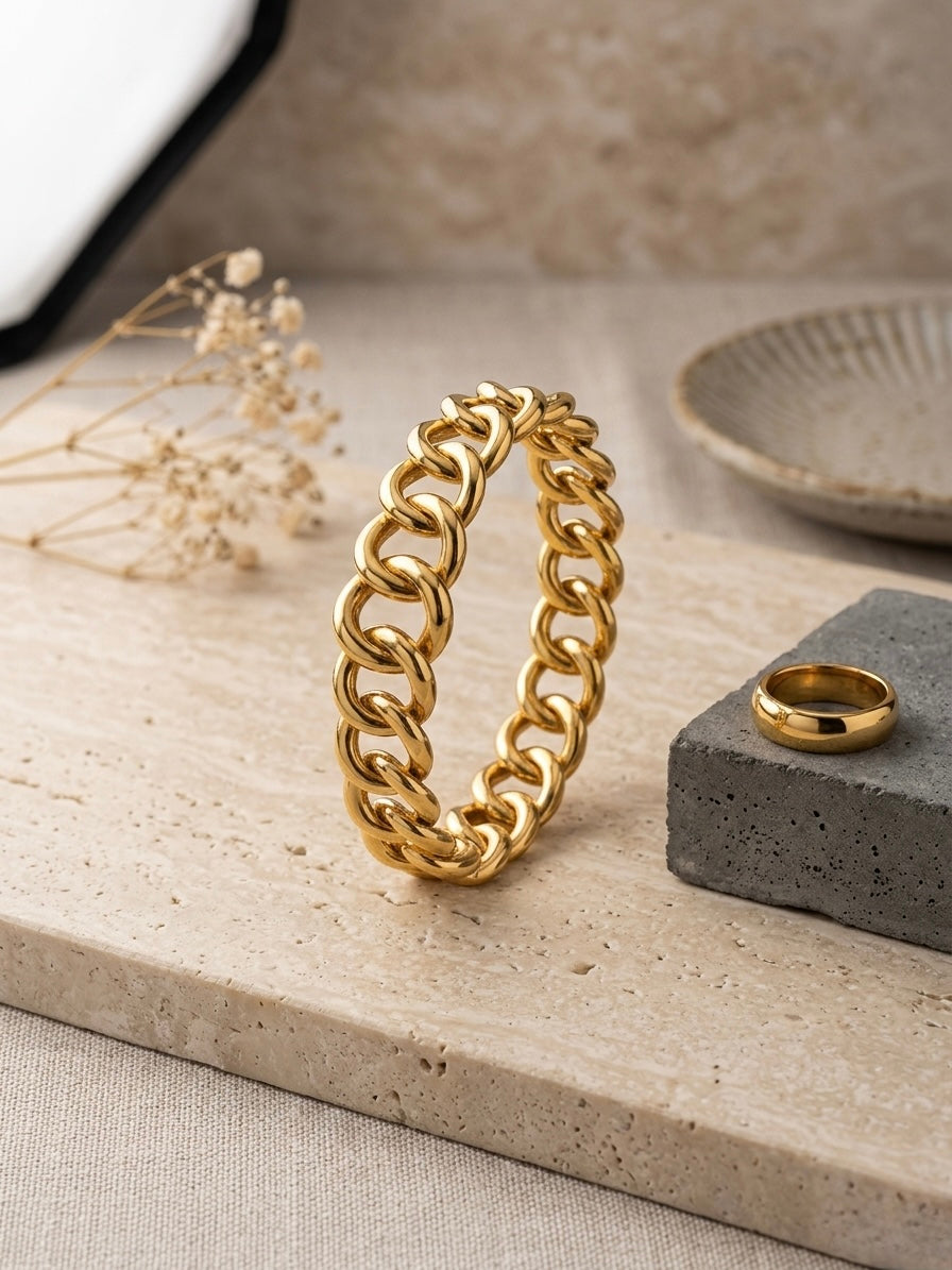 Classic polished gold dome band bracelet .
