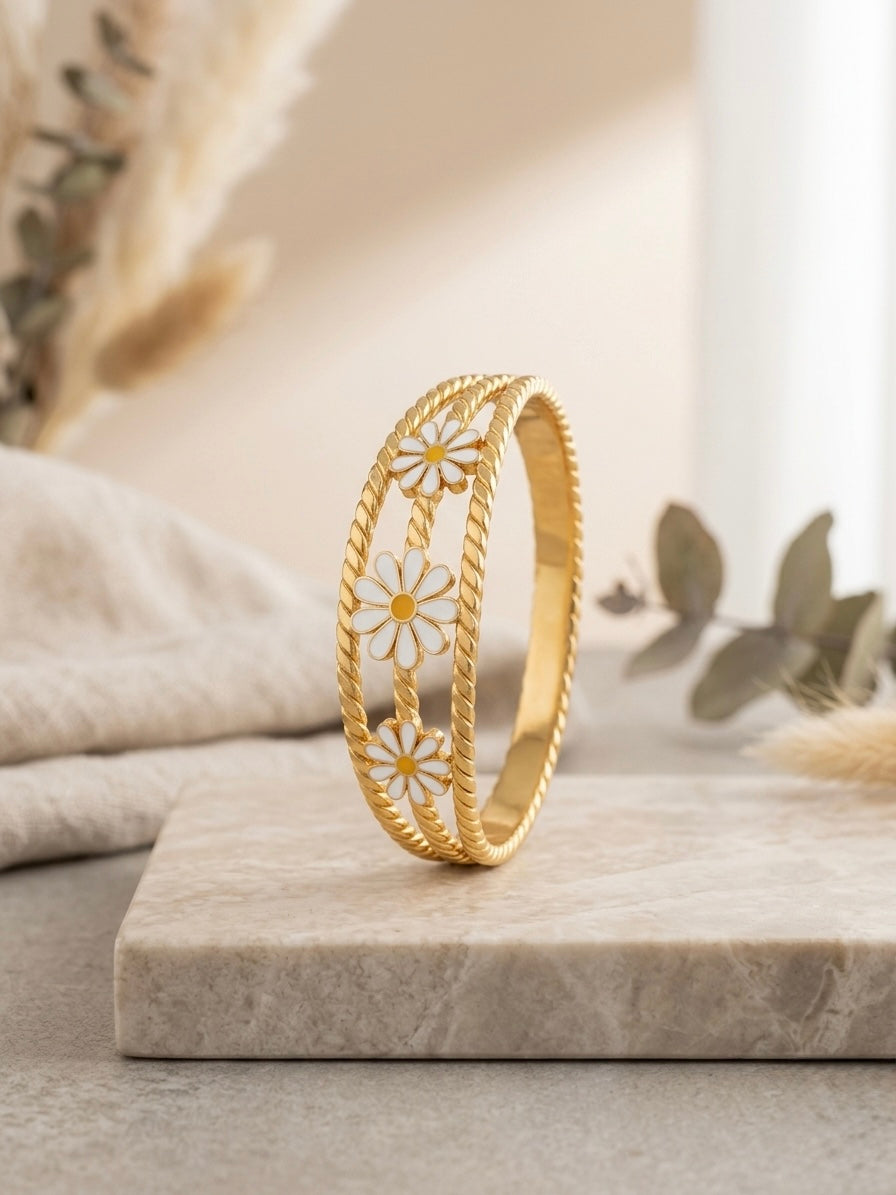 Gold twisted rope enamel daisy bracelet.