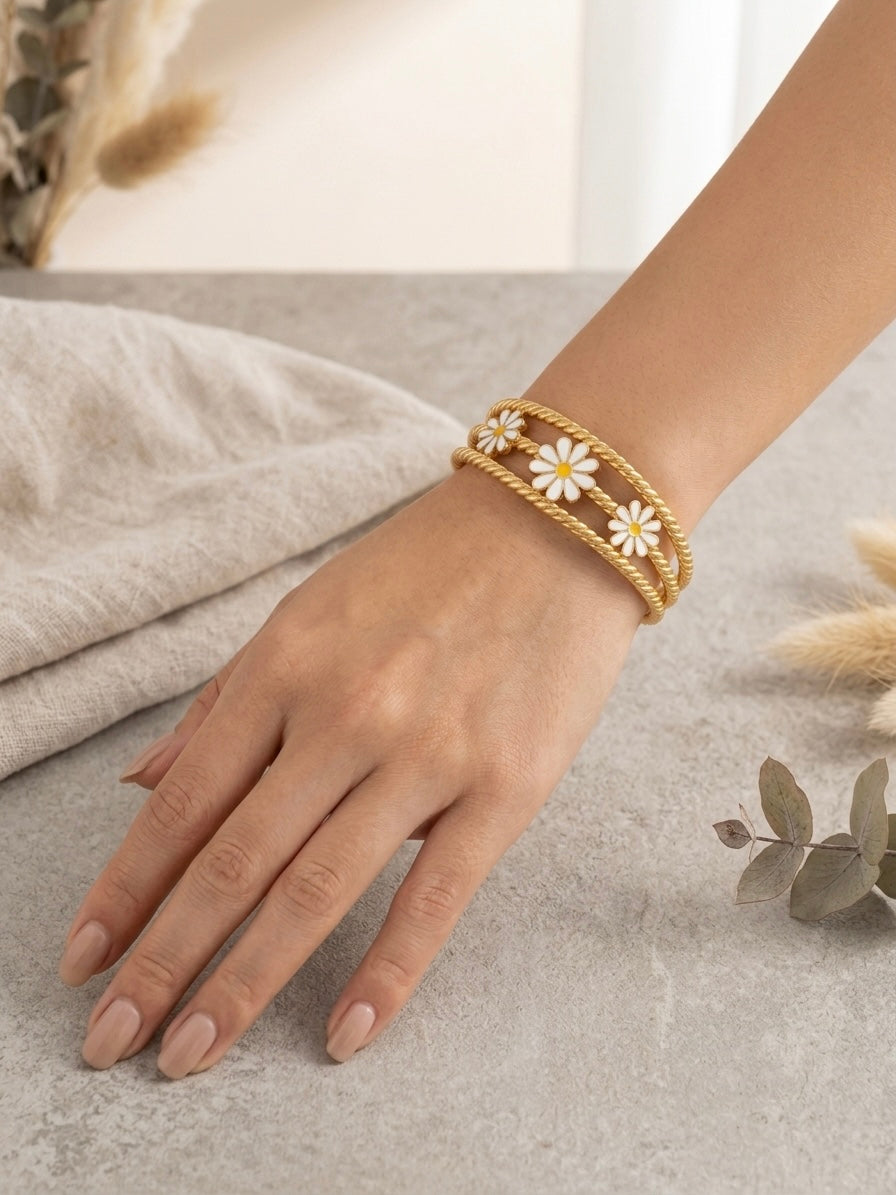 Gold twisted rope enamel daisy bracelet.