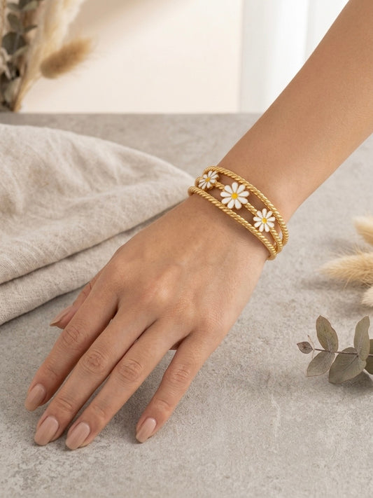 Gold twisted rope enamel daisy bracelet.