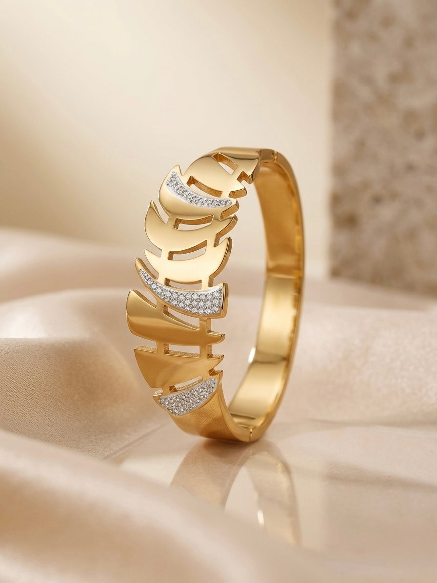 Gold cutout leaf crystal accented bracelet