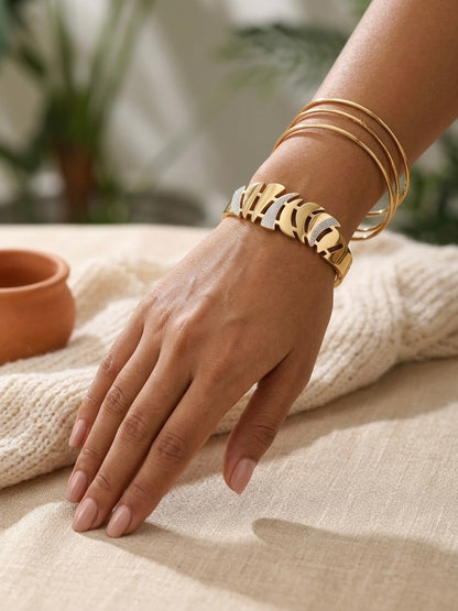 Gold cutout leaf crystal accented bracelet