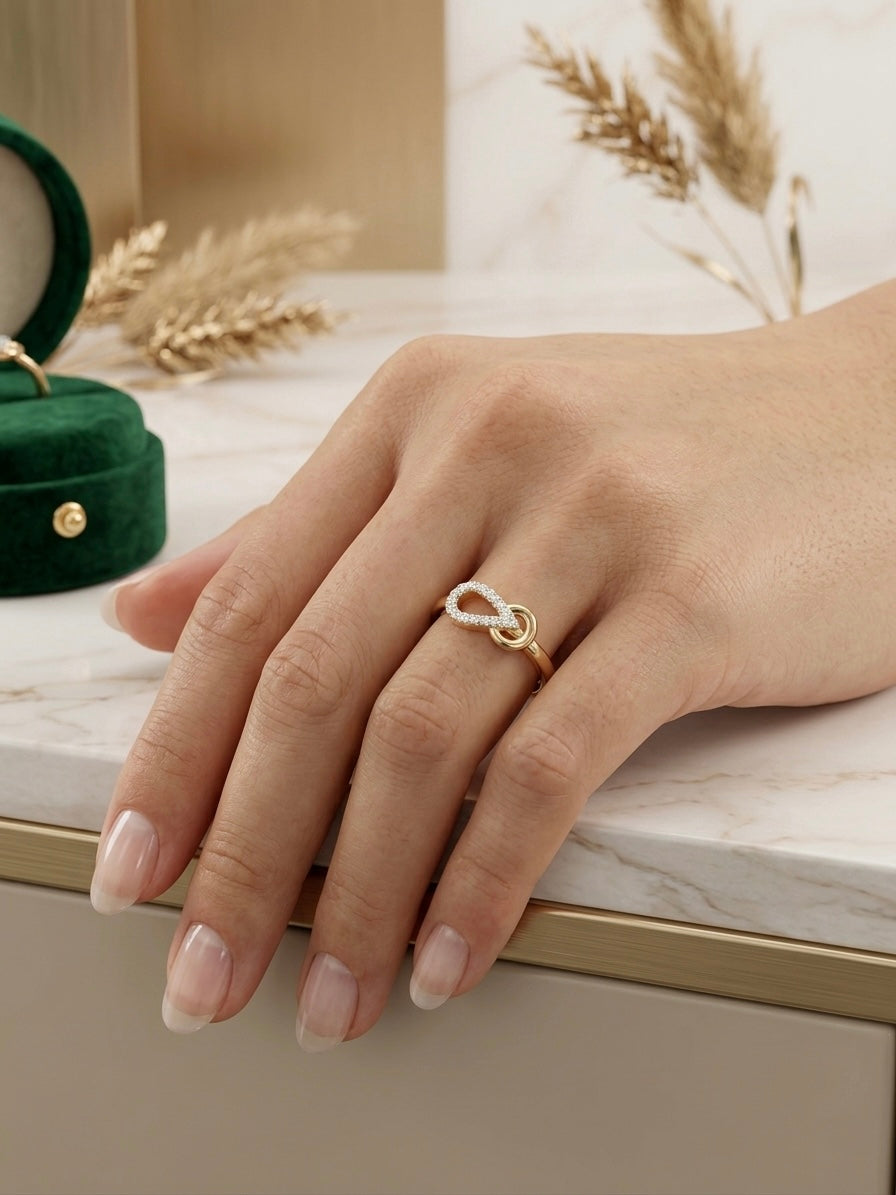 Elegant twisted infinity gold ring.