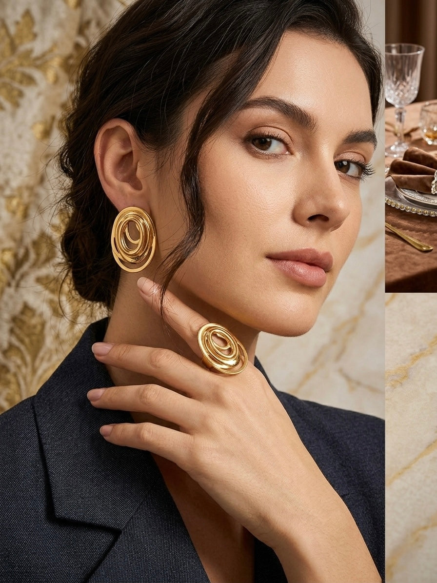Elegant gold swirl ring and earrings.