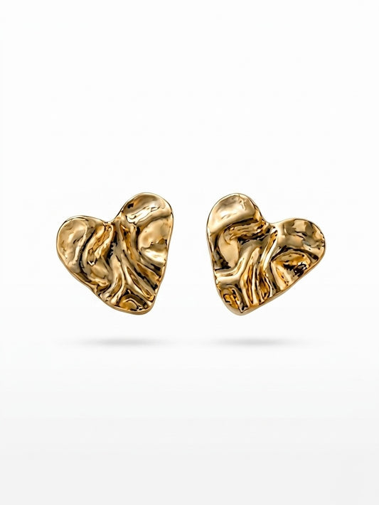 Chic crumpled gold heart statement studs.