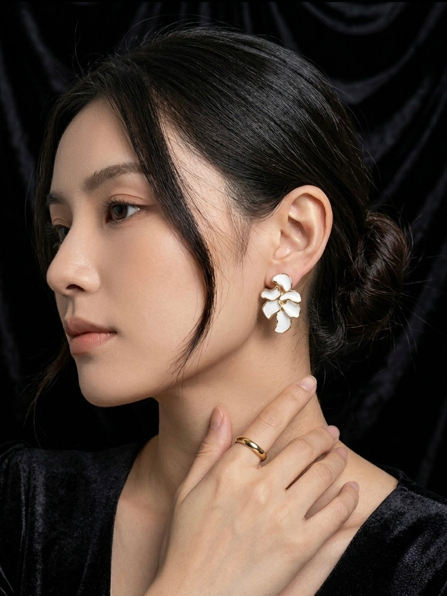Elegant white enamel flower cluster earrings.