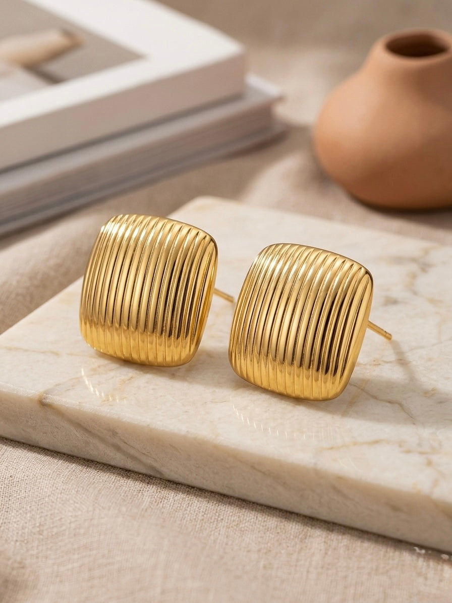 Anti-tarnish ribbed gold square studs.