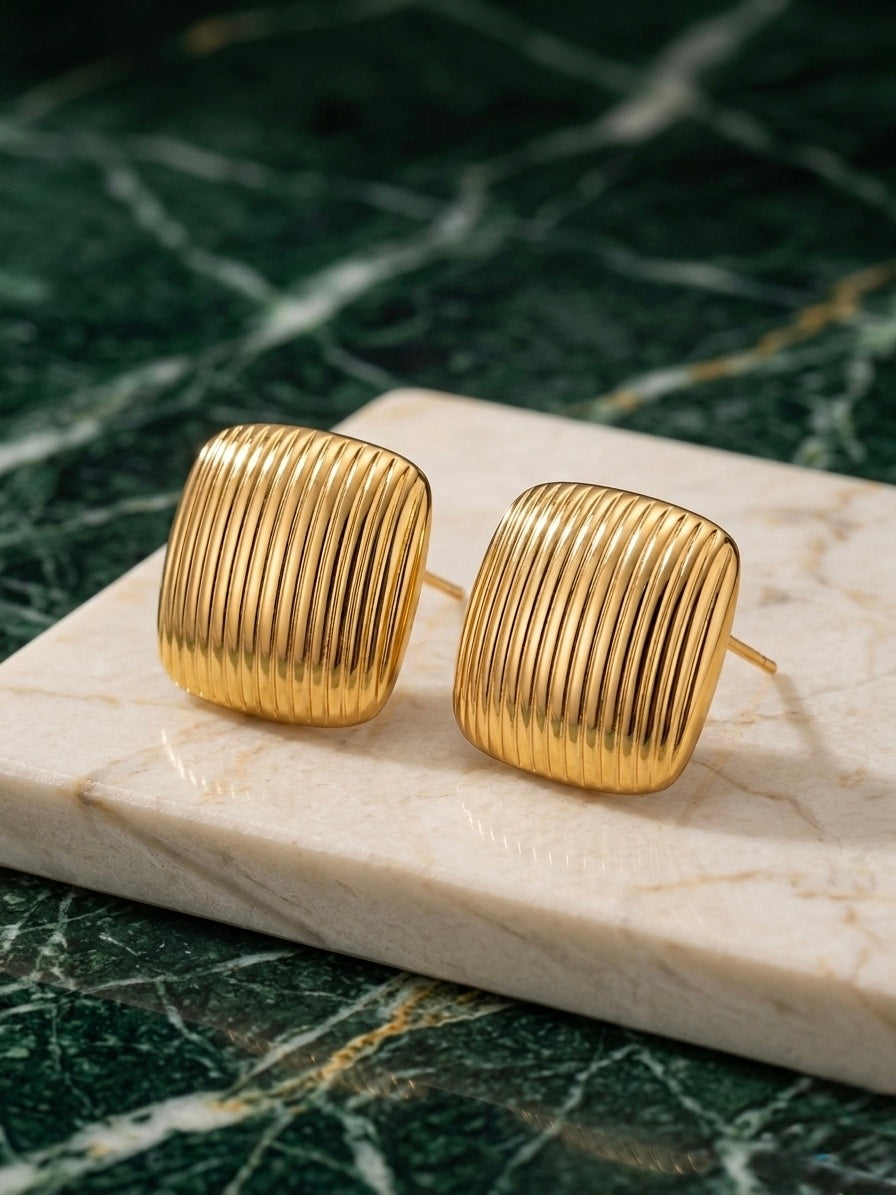 Anti-tarnish ribbed gold square studs.