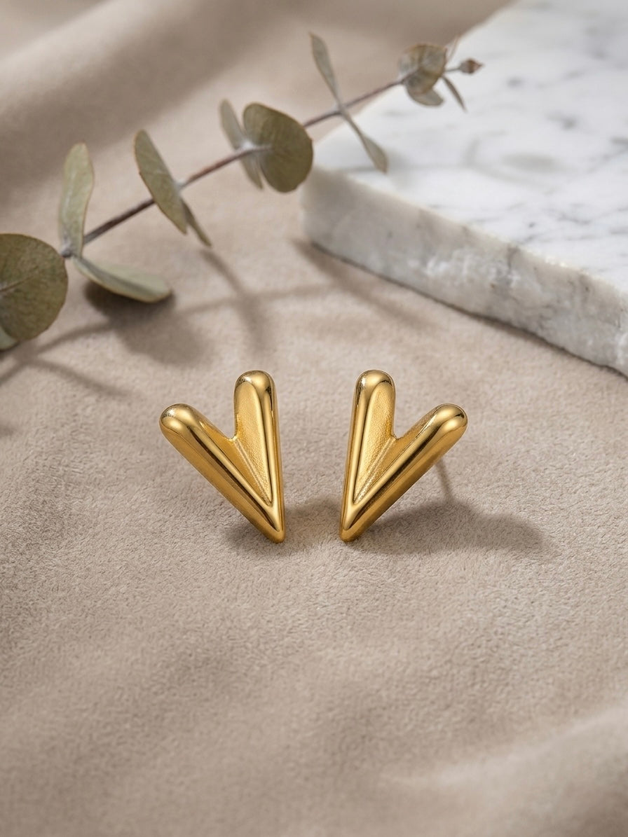 Chic sculptural high-polish gold studs.