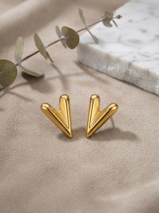 Chic sculptural high-polish gold studs.