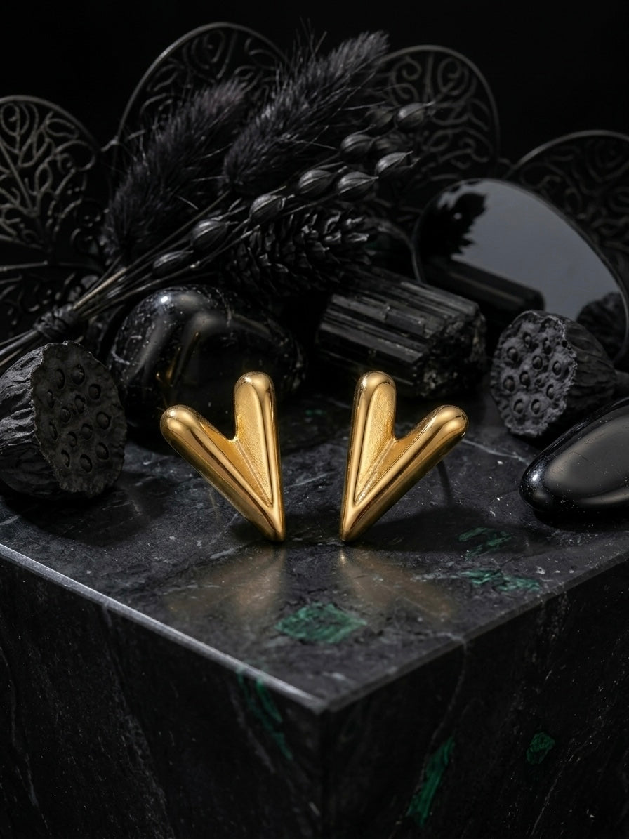 Chic sculptural high-polish gold studs.