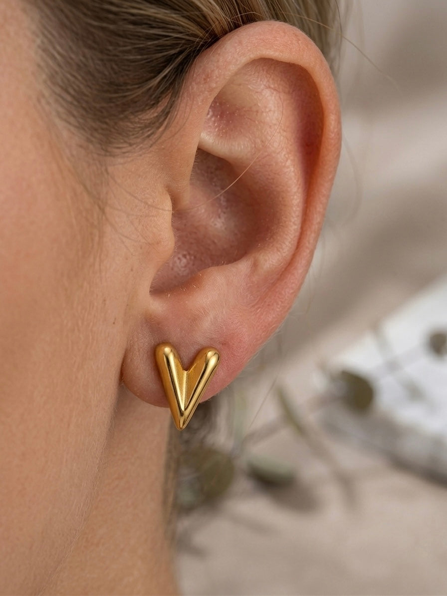 Chic sculptural high-polish gold studs.
