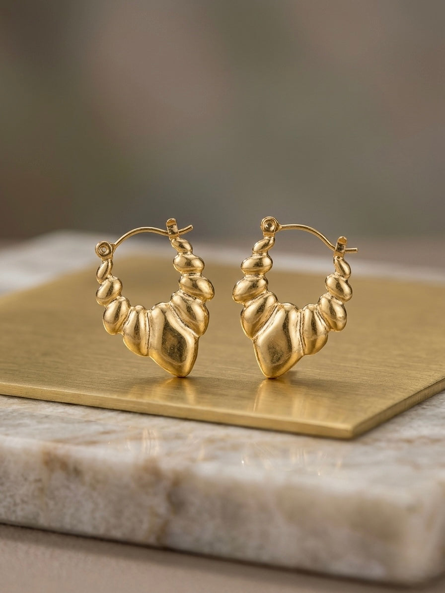 Vintage-inspired textured gold statement earrings.